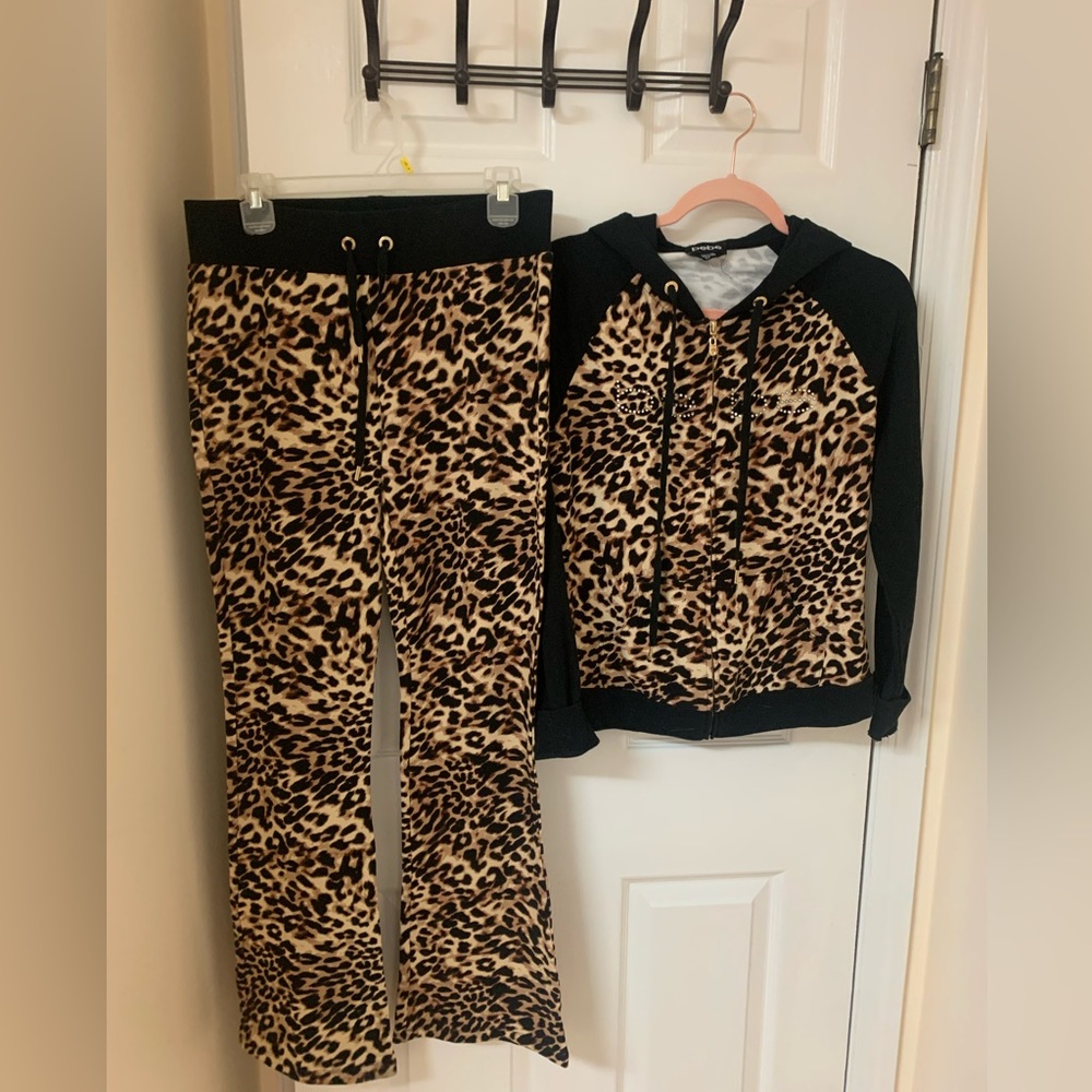 Bebe, women sport track suit , top and pants .